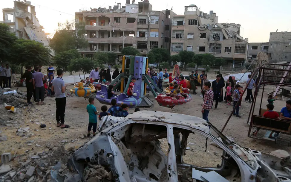 Kinder in Ost-Ghouta, Syrien feiern das Ende des Ramadan. 