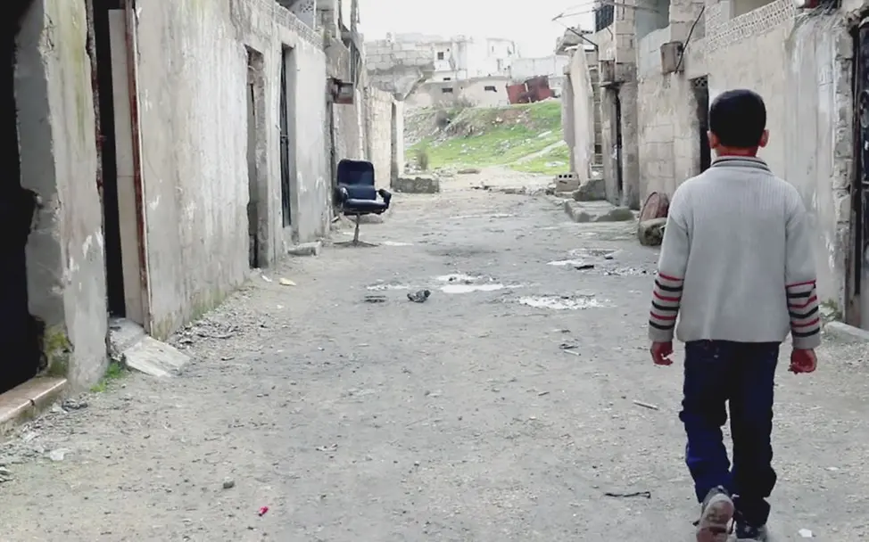 Junge in der zerstörten Stadt Homs | © UNCIEF Syrien-Konflikt: Vier Jahre dauert der Bürgerkrieg an