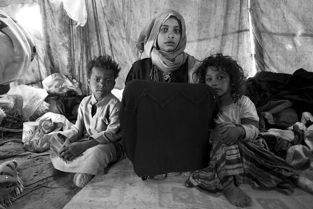 Ibtissam und ihre Geschwister im Zeltlager | © Giles Clarke for UNOCHA Jemen: Ibtissam und ihre Geschwister im Zeltlager