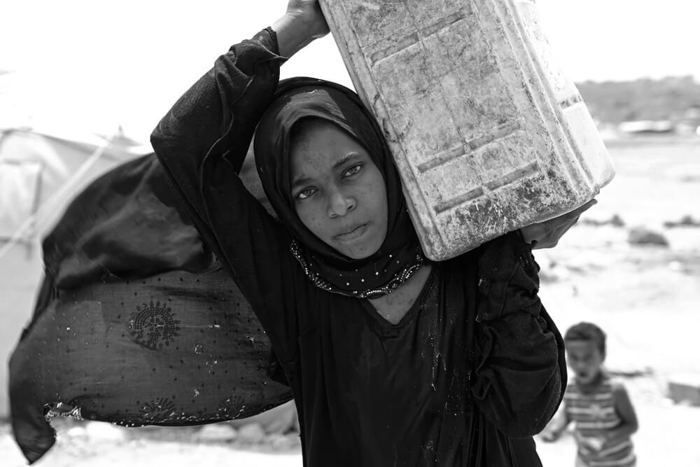 Ashwak beim Wasserholen | © Giles Clarke for UNOCHA Jemen: Ashwak beim Wasserholen
