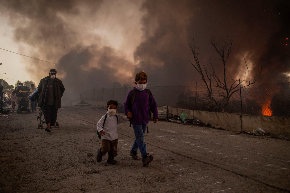 Lesbos, Greece: The flames of misery | © Angelos Tzortzinis, Greece (AFP) Lesbos, Greece: The flames of misery