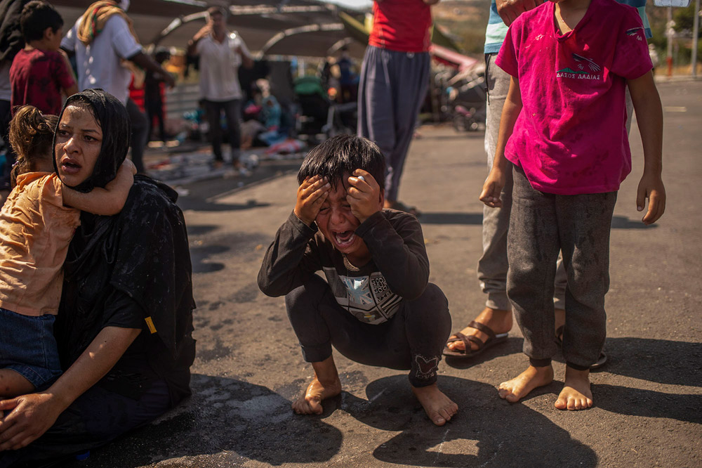 Lesbos, Greece: The flames of misery | © Angelos Tzortzinis, Greece (AFP) Lesbos, Greece: The flames of misery