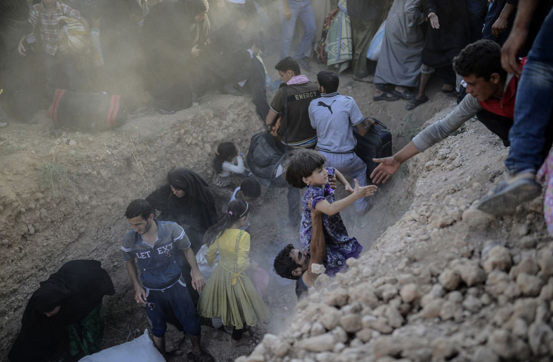 Grenze Syrien/Türkei: Flucht durch den Stacheldraht | © Bülent Kiliç/AFP