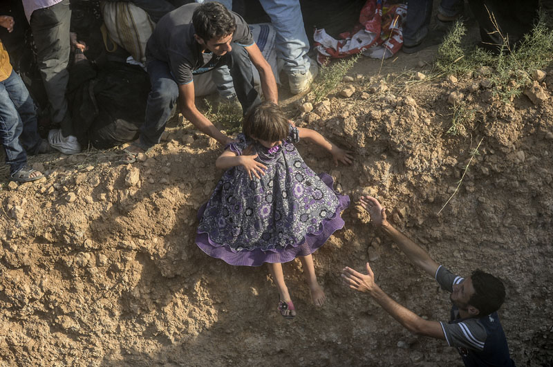 Syrian-Turkish border: Through barbed wire | © Bülent Kiliç/AFP