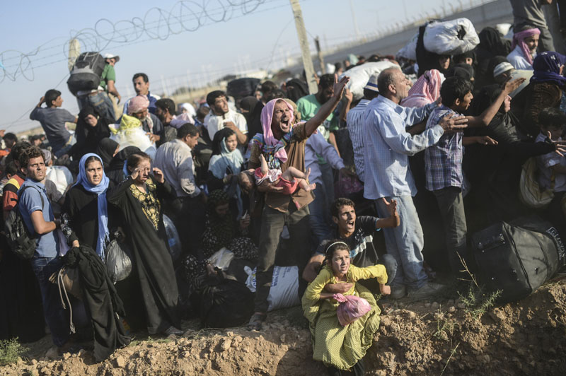 Syrian-Turkish border: Through barbed wire | © Bülent Kiliç/AFP Syrian-Turkish border: Through barbed wire | © Bülent Kiliç/AFP