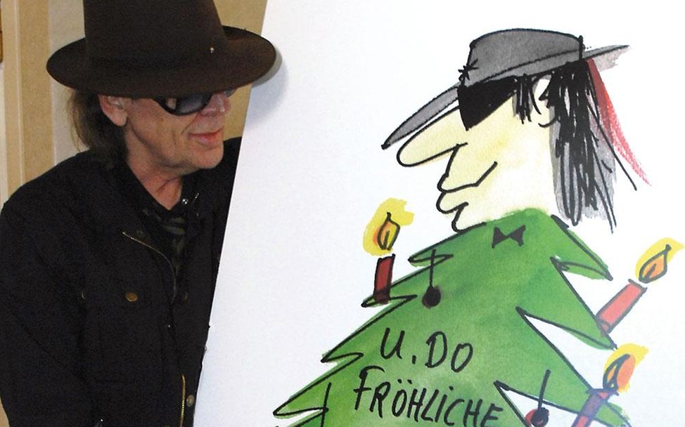Udo Lindenberg präsentiert seine Grußkarte 'U.Do Fröhliche'. | © UNICEF/Langenstrassen